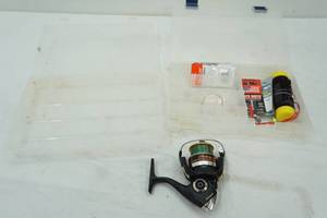 lot 32 image: 2 tackle organizers, contents, and reel