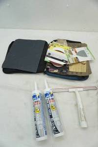 lot 122 image: caulk, squeegee, variety of sandpaper