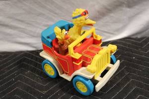 lot 22 image: Vintage Sesame Street Big Bird Push Toy Car