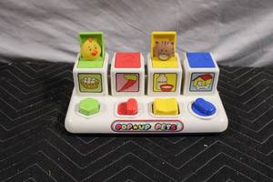 lot 23 image: Vintage Pop-Up Pets Toy with Animal Figures