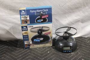 lot 27 image: Jensens Edge Flying Alarm Clock with Propeller