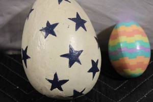 lot 84 image: Pair of Decorative Eggs with Star and Striped Patterns