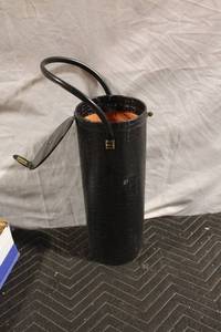 lot 97 image: Vintage Black Embossed Handle Purse with Orange Lining