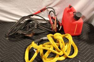 lot 130 image: Automotive Emergency Kit with Jumper Cables, Gas Can, and Tow Rope