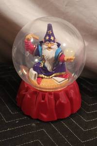 lot 152 image: Musical Wizard Snow Globe with Red Base