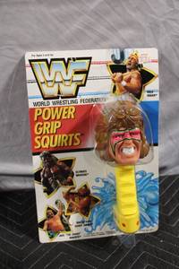 lot A-162 image: WWF Ultimate Warrior Power Grip Squirts Toy