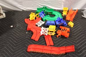lot 263 image: Assorted Plastic Construction Vehicle Playset Tracks and Parts