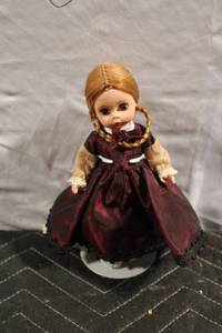 lot 328 image: Vintage Porcelain Doll in Burgundy Dress with Braided Hair