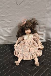 lot 329 image: Vintage Porcelain Doll in Floral Dress with Bow