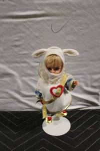 lot 330 image: Vintage Porcelain Doll with Rabbit Ears and Heart Motif
