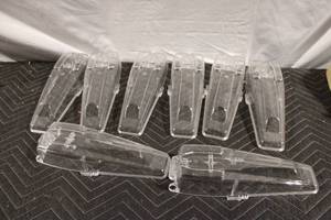 lot 403 image: Set of 8 Clear Plastic Headlight Covers