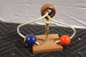 lot 421 image: Wooden Rope Puzzle Game with Red and Blue Beads