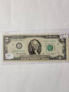 lot 41 image: 1976A  2 Dollar Bill  (Mis-cut from Mint Notice front edge in photo)