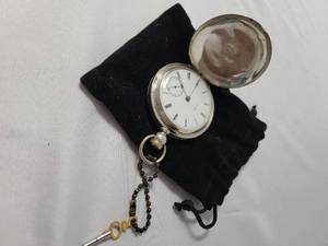 lot 88 image: 1877 Coin Silver Pocket Watch with Key. Video is included with it working.  Coin Silver is equal to 90% Silver.
