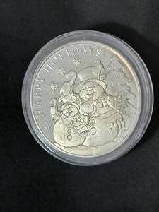 lot 12 image: 2019 Seasons Greeting 1 Troy Oz. Silver Round  (cased)