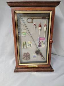 lot 90 image: 8 12 x 13 inch ShadowboxChest with Fishing Theme.  Includes 3 bobbers and tape measurescale for fishing.