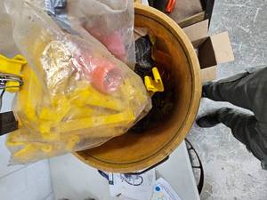 lot 81 image: Bucket of Insulators for Electric Fence, and Yamaha 660 Rhino Carburetor, like new
