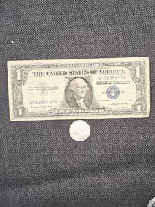 lot 131 image: 1957A Silver Certificate and 1964 Canadian Quarter