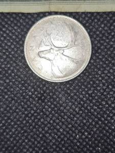 lot 130 image: 1934-1984 Canadian 1oz. Silver Dollar with Sterling Silver Chain