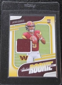 lot 6 image: 2024 Absolute Rookie Materials Jersey Relic Jayden Daniels #ARM-JDS Rookie Card