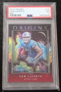 lot 23 image: 2023 Origins Red Sam LaPorta #115 PSA 7 Rookie Card 100149  Only 149 Exist