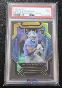 lot 98 image: 2021 Select Die Cut Black Gold Prizm Amon-Ra St. Brown #273 Rookie Card PSA 9