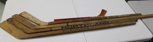 lot 145 image: Vintage Hockey Stick Lot w Chicago Blackhawks Commemorative Stick  5 Hockey Sticks
