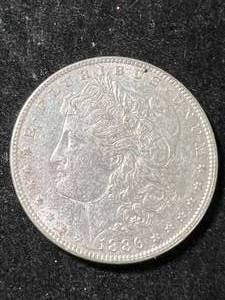 lot 82 image: 1886 US MORGAN SILVER DOLLAR