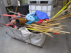 lot 30 image: Large Lot of Dust Mop Heads & Handles, Laundry Bags, Rug, Large Rolling Laundry Tub