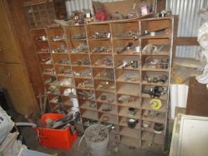 lot 99 image: Shelving Unit wContents of Pipe Fittings & Misc.