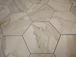 lot 39 image: Lot of 25 8x9 Lamorama High-Quality Marble Hexagon Floor Tiles
