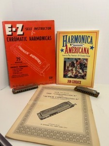 lot 325 image: Vintage Chromatic Harmonicas Set with Sheet Music and Instruction Books