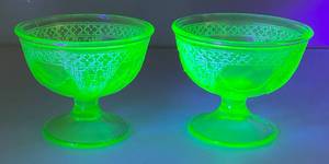 lot 224 image: Vintage Pair Of Federal Georgian Lovebirds Green Uranium Footed Sherbert Glasses (Glow Under UV Light)