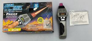 lot 272 image: 1992 Playmates STAR TREK The Next Generation Collectors Edition No. 063731 Phaser (Open Box) untested Package Has Normal Shelf Wear