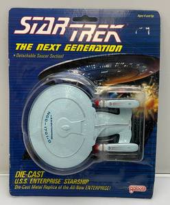 lot 273 image: Star Trek The Next Generation 1988 Galoob Die Cast USS Enterprise Starship (New On Card Old Stock) Card Has Normal Shelf Wear