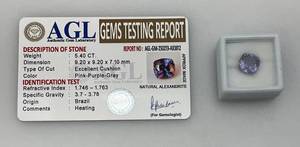 lot 289 image: AGL Authentic Gem Laboratory 5.40 CT Excellent Cushion Pink-Purple-Gray Natural Alexandrite With ID Card