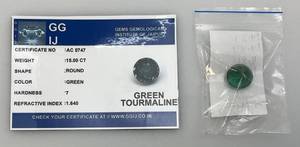 lot 290 image: GG IJ Gems Gemological Institute Of Jaipur 15.00 CT Round Green Tourmaline With ID Card