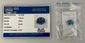 lot 291 image: GG IJ Gems Gemological Institute Of Jaipur 7.50 CT Oval Blue Topaz With ID Card