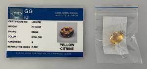 lot 292 image: GG IJ Gems Gemological Institute Of Jaipur 17.45 CT Oval Yellow Citrine With ID Card