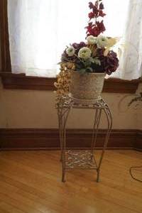 lot 15 image: Metal Plant stand with artificial flower arrangement