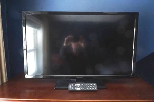 lot 103 image: Insignia LED Flat Screen TV & remote