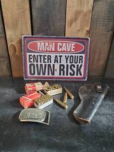 lot 32 image: Man Cave Lot Metal sign Shells, Remington Belt Buckle and Gun Holster