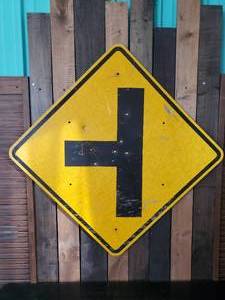 lot 60 image: Vintage Large Sign Large T with bullet Holes  Wild Bill Shoot out perhaps  Ha ha ha