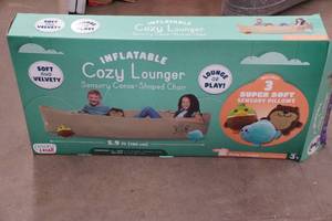lot 60 image: Inflatable Cozy Lounger Sensory Canoe-Shaped Chair