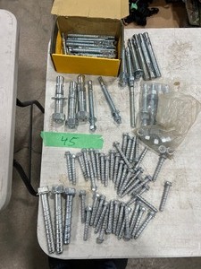 TABLE FULL OF  CONCRETE ANCHORS