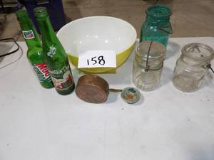 VINTAGE GLASSWARE, YELLOW PYREX 3 BALL JARS 1 W LID, 2 OLD MT DEW BOTTLES, & COPPER LADSEL
