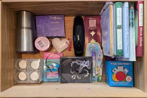 lot 195 image: Mixed Lot of Household Items Including Books, Electronics, and Accessories