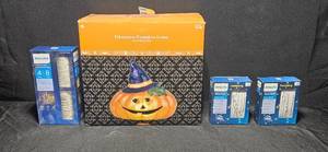lot 131 image: Halloween Fiber Glass Pumpkin Lamp and Sets of String Twinkle Lights NIB