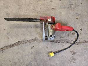 lot 18 image: Electric Chainsaw with Red and Metal Finish