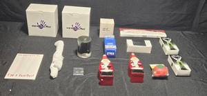lot 452 image: Assorted Holiday Gifts - Santa Decor, Earrings, Candles, and More